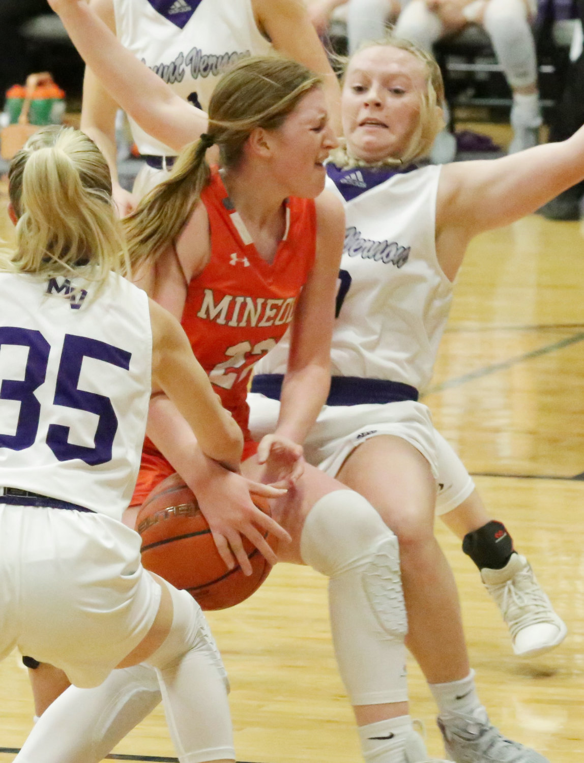 This accurately depicts the physicality of the play between Mineola and Mt. Vernon last Friday. Here, Macy Fischer forces her way through a crowd.